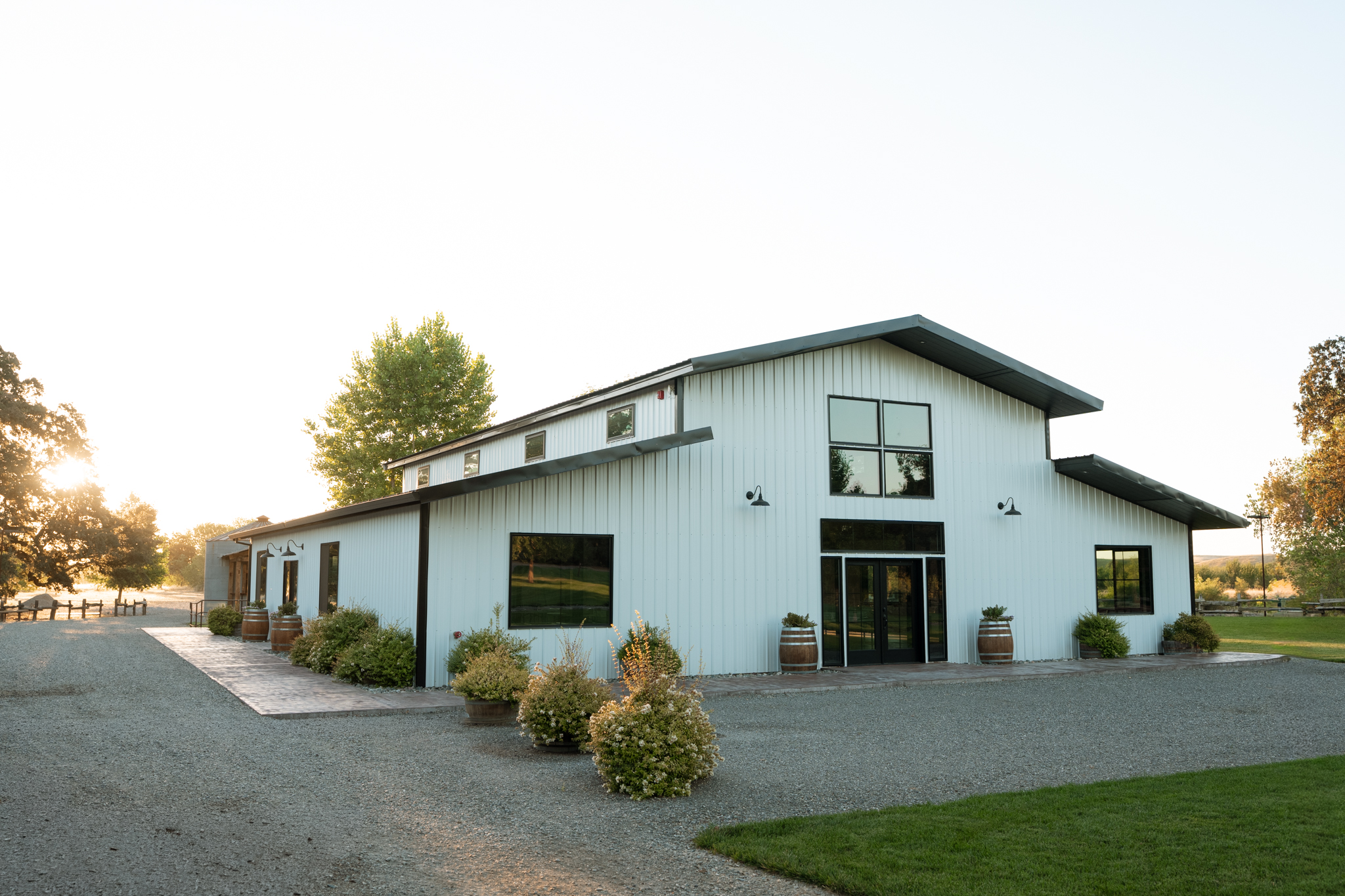 The white barn from the side at golden hour