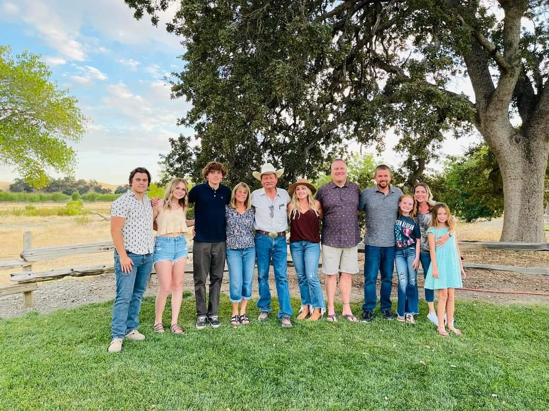 Three generations of the Hubbard family beneath the heritage oak at the ranch